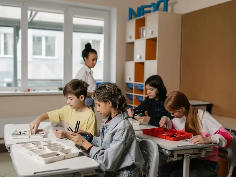 Students working together at their desks during a lesson